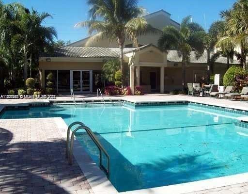 5780 Rock Island Rd Unit 354, Tamarac, FL 33319 - community pool with a patio