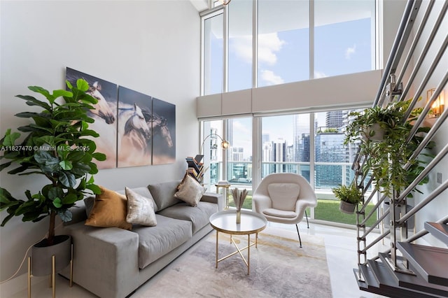 41 SE 5th St Unit 2306, Miami, FL 33131 - living room featuring a view of city, stairway, and a high ceiling
