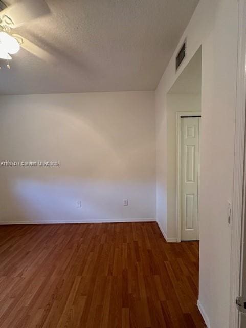 11479 NW 60th Ter Unit 372, Doral, FL 33178 - empty room featuring wood finished floors, a textured ceiling, and a ceiling fan