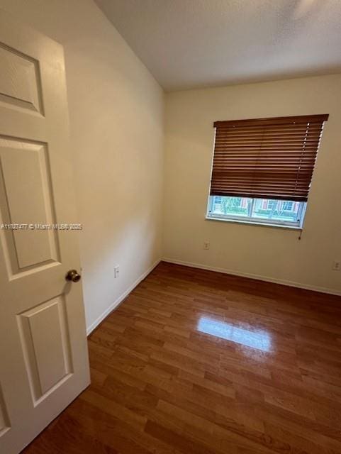 11479 NW 60th Ter Unit 372, Doral, FL 33178 - unfurnished room featuring wood finished floors and baseboards