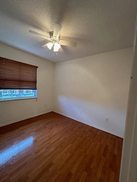 11479 NW 60th Ter Unit 372, Doral, FL 33178 - spare room with a ceiling fan, wood finished floors, and a textured ceiling