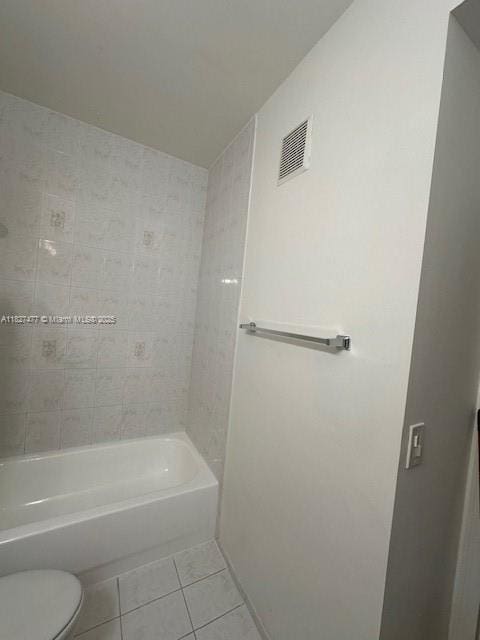 11479 NW 60th Ter Unit 372, Doral, FL 33178 - bathroom with tile patterned flooring and  shower combination