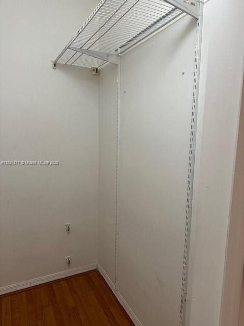 11479 NW 60th Ter Unit 372, Doral, FL 33178 - walk in closet with wood finished floors