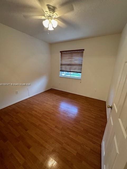 11479 NW 60th Ter Unit 372, Doral, FL 33178 - spare room featuring wood finished floors, ceiling fan, and a textured ceiling