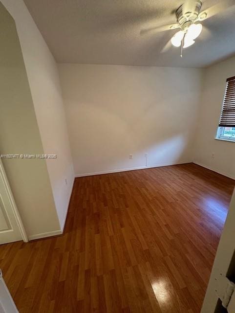 11479 NW 60th Ter Unit 372, Doral, FL 33178 - empty room featuring wood finished floors and ceiling fan