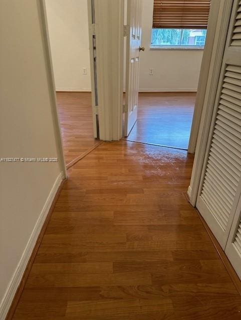 11479 NW 60th Ter Unit 372, Doral, FL 33178 - corridor with baseboards and wood finished floors