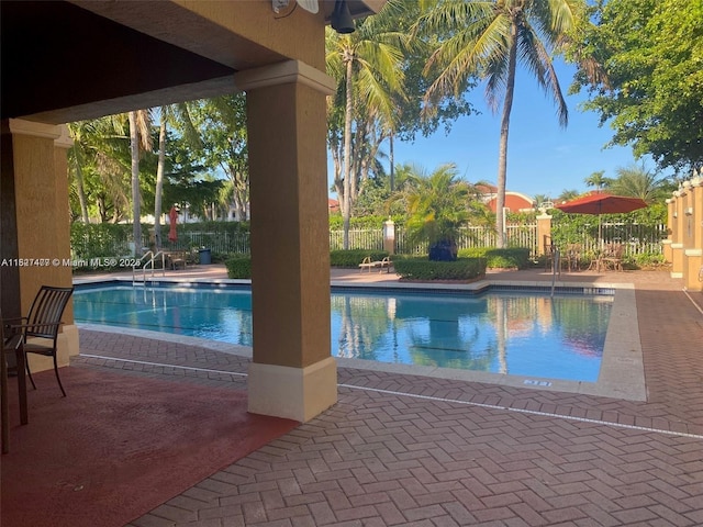 11479 NW 60th Ter Unit 372, Doral, FL 33178 - community pool with a fenced backyard and a patio