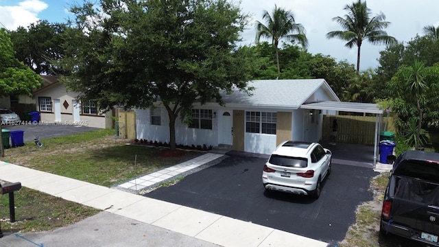 1657 SW 44th Ave, Fort Lauderdale, FL 33317 - view of front of property with a carport and driveway