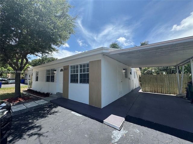 1657 SW 44th Ave, Fort Lauderdale, FL 33317 - view of property exterior featuring a carport
