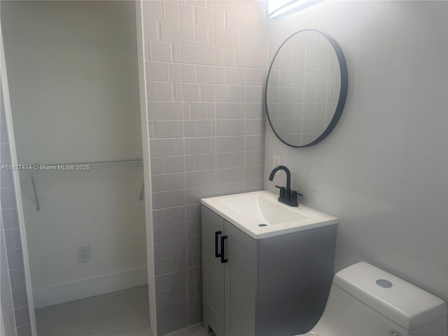 1657 SW 44th Ave, Fort Lauderdale, FL 33317 - bathroom featuring vanity and tile walls