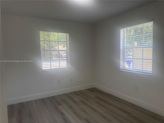 1657 SW 44th Ave, Fort Lauderdale, FL 33317 - unfurnished room featuring wood finished floors and healthy amount of natural light