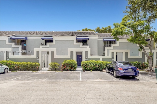 2326 SW 82nd Ter, North Lauderdale, FL 33068 - view of front facade with a tiled roof, uncovered parking, and stucco siding
