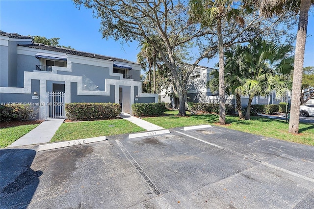 2326 SW 82nd Ter, North Lauderdale, FL 33068 - view of building exterior featuring uncovered parking