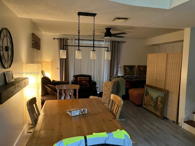 2326 SW 82nd Ter, North Lauderdale, FL 33068 - dining room with a ceiling fan, wood finished floors, and a textured ceiling