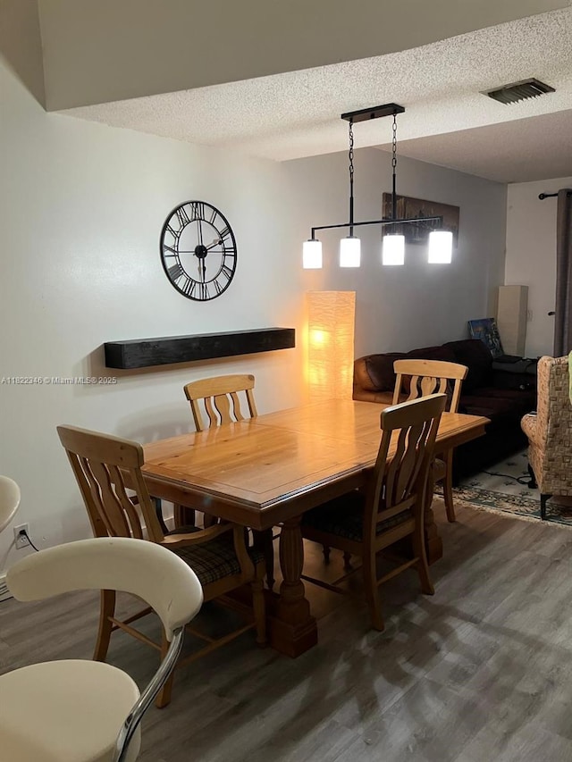 2326 SW 82nd Ter, North Lauderdale, FL 33068 - dining room with wood finished floors and a textured ceiling