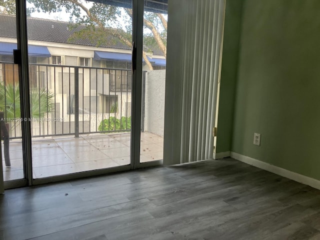 2326 SW 82nd Ter, North Lauderdale, FL 33068 - doorway with baseboards and wood finished floors