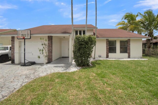 4947 NW 91st Ter, Sunrise, FL 33351 - view of front of house featuring stucco siding and brick siding