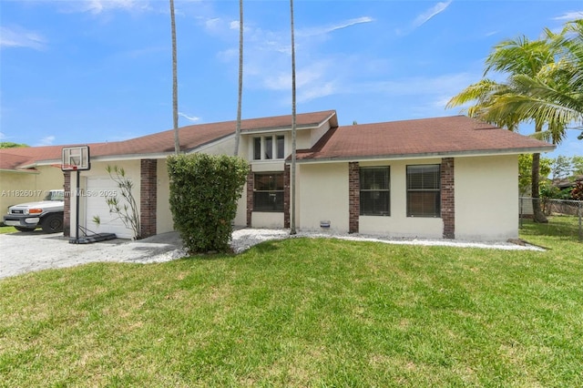 4947 NW 91st Ter, Sunrise, FL 33351 - view of front of property featuring an attached garage and stucco siding
