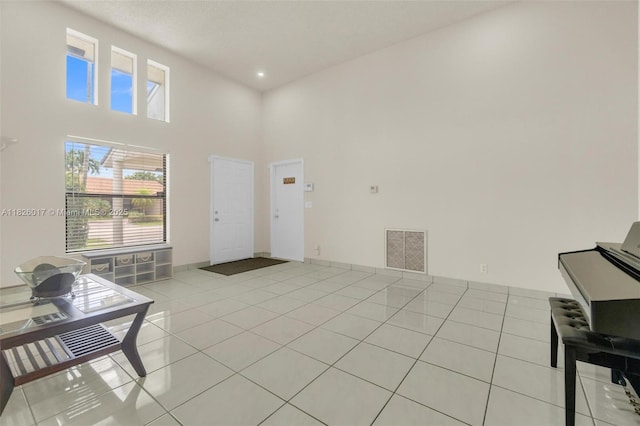 4947 NW 91st Ter, Sunrise, FL 33351 - entryway with light tile patterned floors, a high ceiling, and recessed lighting