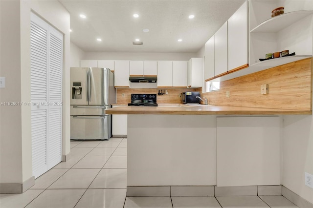 4947 NW 91st Ter, Sunrise, FL 33351 - kitchen featuring stainless steel fridge, black electric range oven, under cabinet range hood, open shelves, and a peninsula