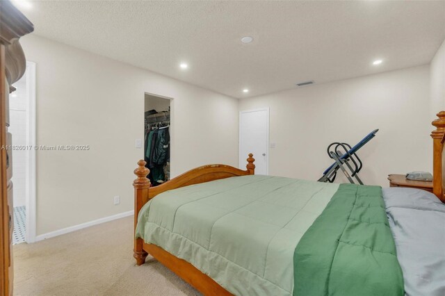 4947 NW 91st Ter, Sunrise, FL 33351 - carpeted bedroom with recessed lighting and a walk in closet