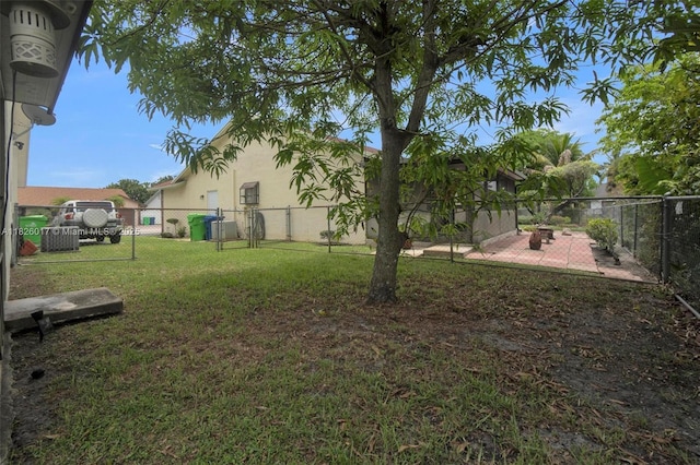4947 NW 91st Ter, Sunrise, FL 33351 - fenced backyard with a patio area