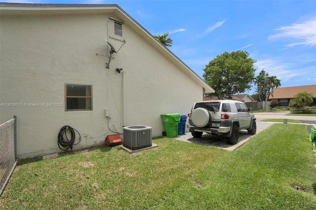 4947 NW 91st Ter, Sunrise, FL 33351 - view of side of home with stucco siding and a lawn
