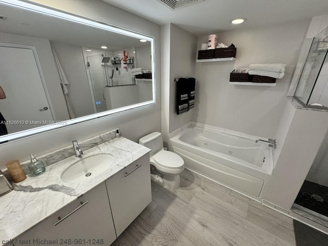 500 Brickell Ave Unit 3803, Miami, FL 33131 - bathroom featuring a whirlpool tub, vanity, a shower, and recessed lighting