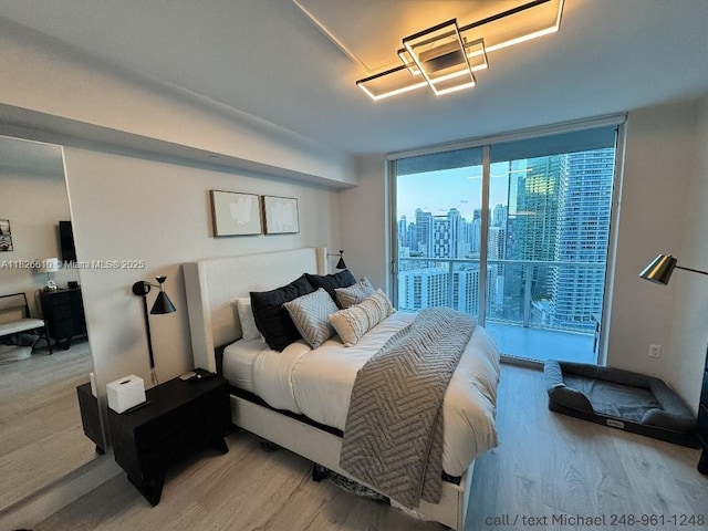 500 Brickell Ave Unit 3803, Miami, FL 33131 - bedroom featuring light wood finished floors and access to exterior
