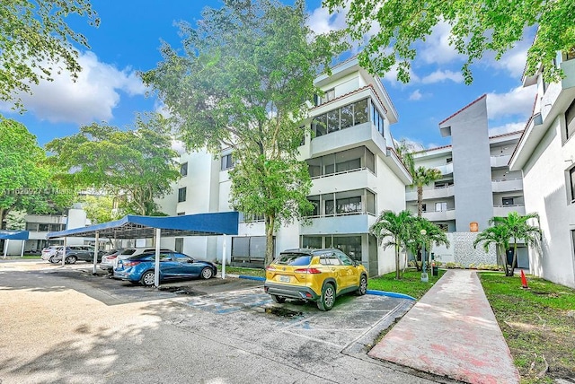 8365 SW 152nd Ave Unit C-201, Miami, FL 33193 - view of property featuring covered and uncovered parking