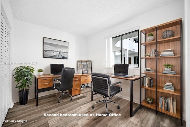 8365 SW 152nd Ave Unit C-201, Miami, FL 33193 - office area featuring wood finished floors and a textured ceiling