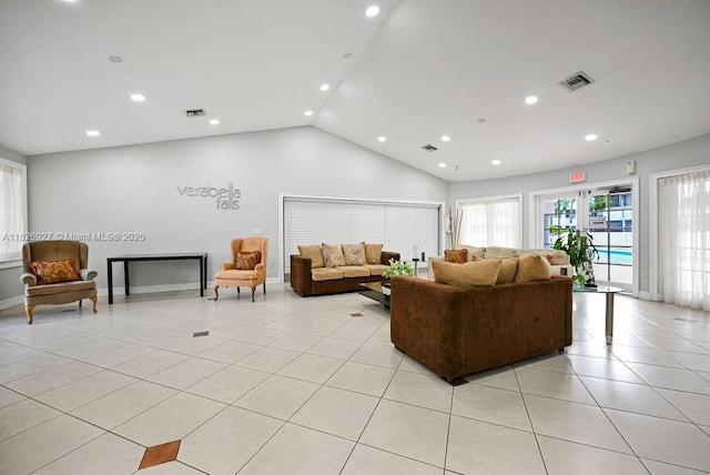 8365 SW 152nd Ave Unit C-201, Miami, FL 33193 - living area with light tile patterned floors, lofted ceiling, and recessed lighting