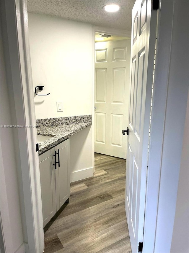 8365 SW 152nd Ave Unit C-201, Miami, FL 33193 - bathroom with wood finished floors, vanity, and recessed lighting