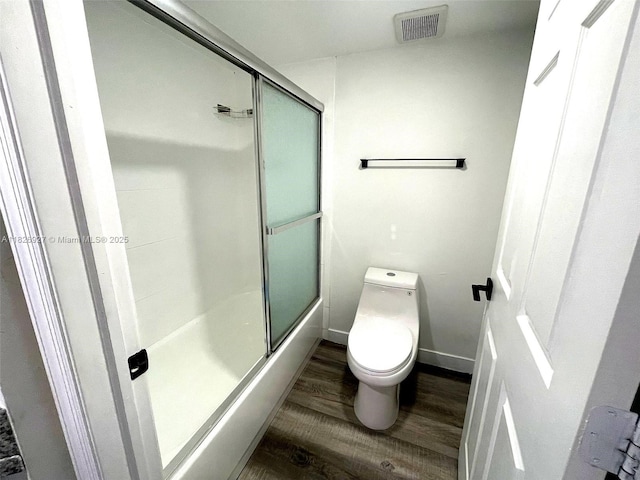 8365 SW 152nd Ave Unit C-201, Miami, FL 33193 - full bathroom featuring wood finished floors and combined bath / shower with glass door