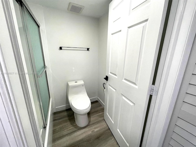 8365 SW 152nd Ave Unit C-201, Miami, FL 33193 - full bathroom with wood finished floors and a shower with shower door
