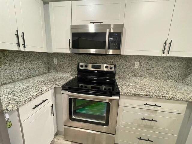 8365 SW 152nd Ave Unit C-201, Miami, FL 33193 - kitchen featuring stainless steel appliances and white cabinets
