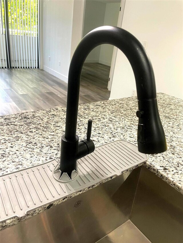 8365 SW 152nd Ave Unit C-201, Miami, FL 33193 - detailed view of wood finished floors and a sink
