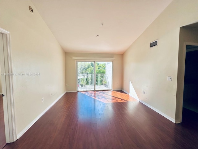11185 SW 6th St Unit 303, Pembroke Pines, FL 33025 - spare room featuring hardwood / wood-style flooring and lofted ceiling