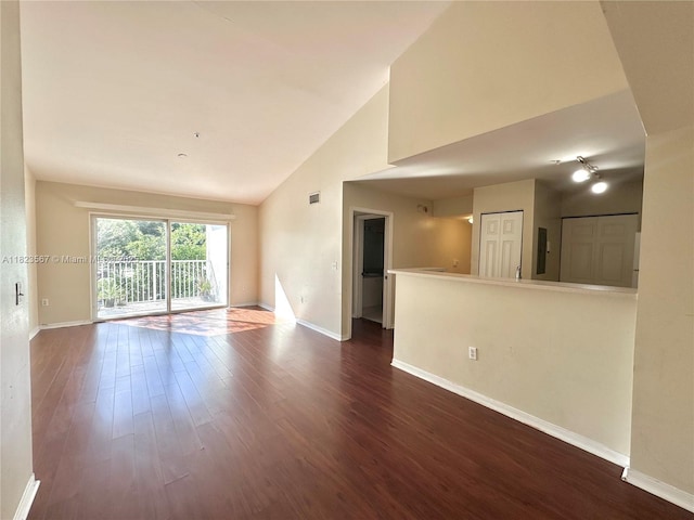 11185 SW 6th St Unit 303, Pembroke Pines, FL 33025 - empty room with dark wood finished floors and high vaulted ceiling