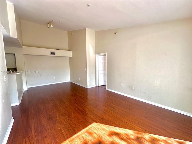11185 SW 6th St Unit 303, Pembroke Pines, FL 33025 - empty room featuring wood finished floors, fire sprinkler in ceiling, and rail lighting
