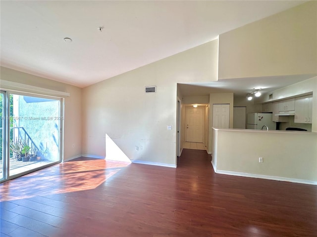 11185 SW 6th St Unit 303, Pembroke Pines, FL 33025 - unfurnished living room featuring dark wood-style floors and high vaulted ceiling