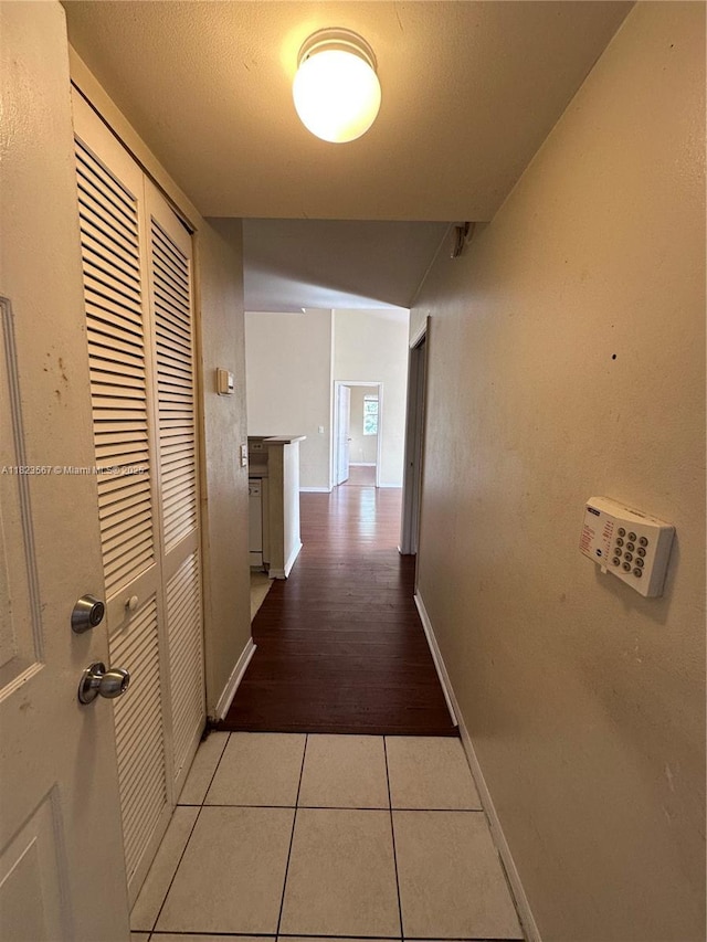 11185 SW 6th St Unit 303, Pembroke Pines, FL 33025 - hall featuring tile patterned flooring and baseboards