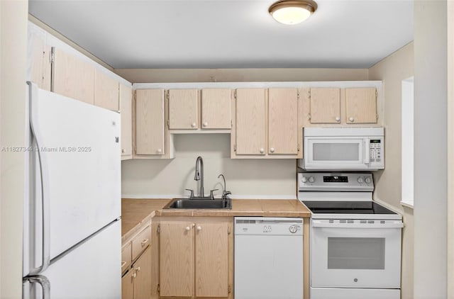 16851 NE 23rd Ave Unit A619, North Miami Beach, FL 33160 - kitchen featuring white appliances, light countertops, and light brown cabinets