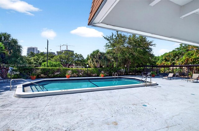 16851 NE 23rd Ave Unit A619, North Miami Beach, FL 33160 - community pool with a patio