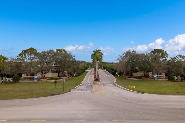 16825 Berkshire Ct, Southwest Ranches, FL 33331 - view of asphalt street featuring traffic signs and view of scattered trees