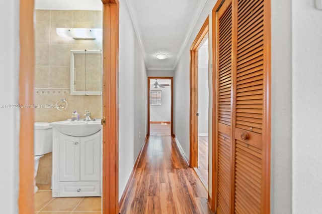 20155 E Oakmont Cir, Hialeah, FL 33015 - hall with crown molding and a sink