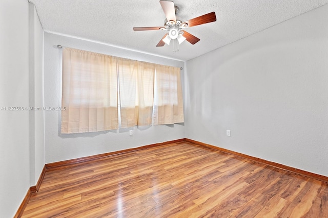 20155 E Oakmont Cir, Hialeah, FL 33015 - spare room featuring a ceiling fan, a textured ceiling, and wood finished floors
