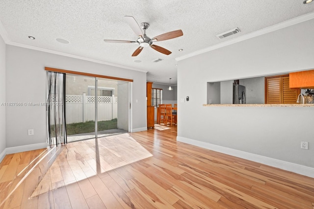 20155 E Oakmont Cir, Hialeah, FL 33015 - unfurnished room featuring a ceiling fan, crown molding, light wood-style floors, and a textured ceiling