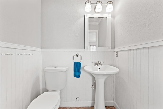 20155 E Oakmont Cir, Hialeah, FL 33015 - bathroom with toilet and wainscoting