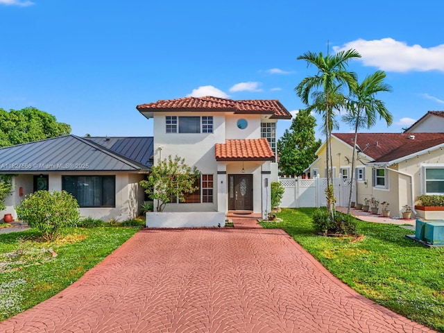 20155 E Oakmont Cir, Hialeah, FL 33015 - mediterranean / spanish home with a standing seam roof, stucco siding, a metal roof, and a tile roof